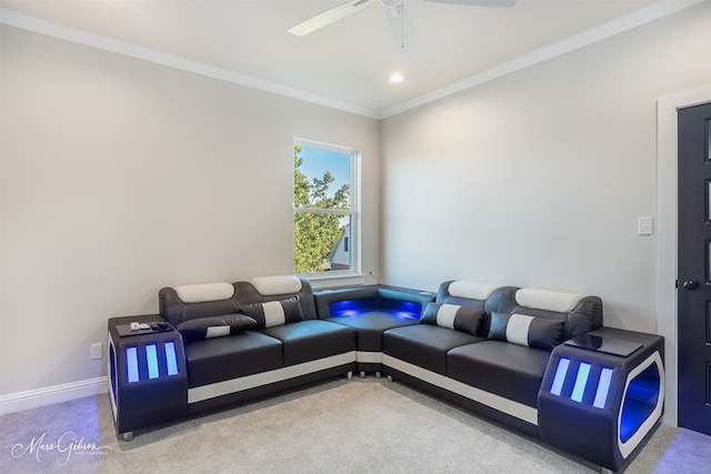 carpeted living room with crown molding and ceiling fan