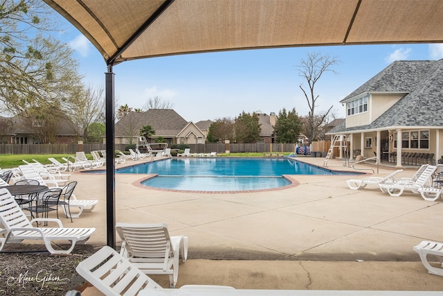 view of swimming pool with a patio area