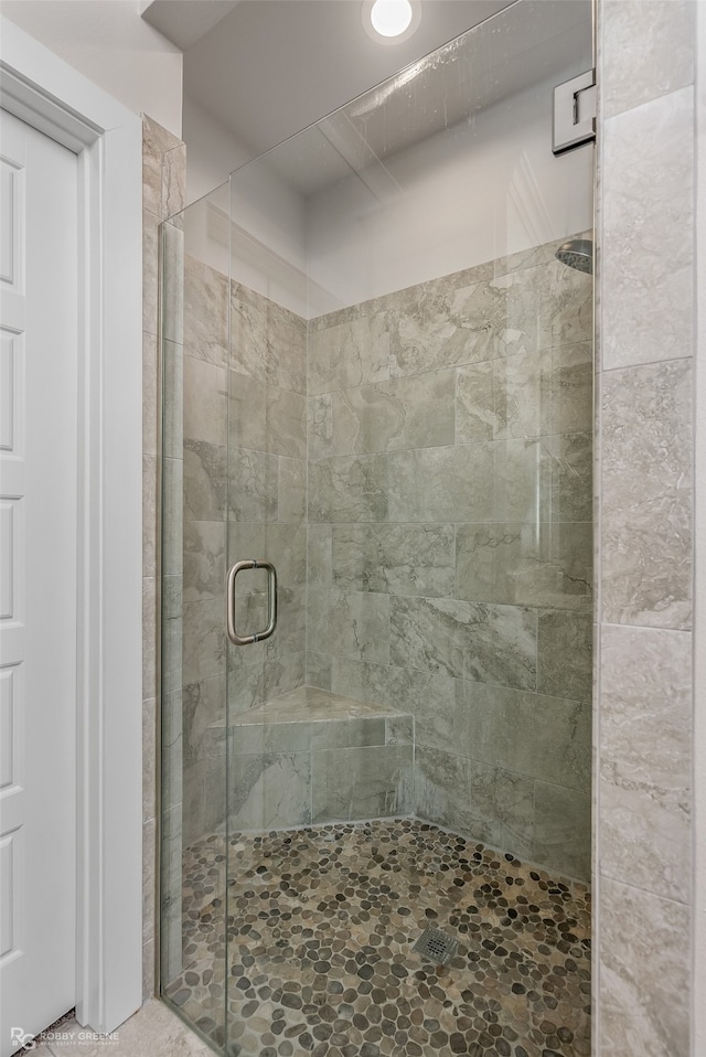 bathroom with an enclosed shower