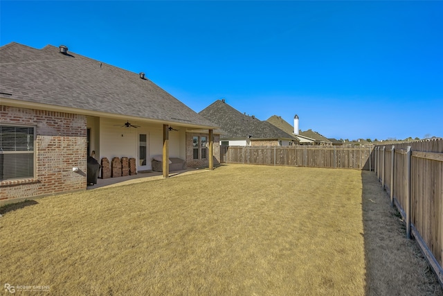 view of yard featuring ceiling fan and a patio area