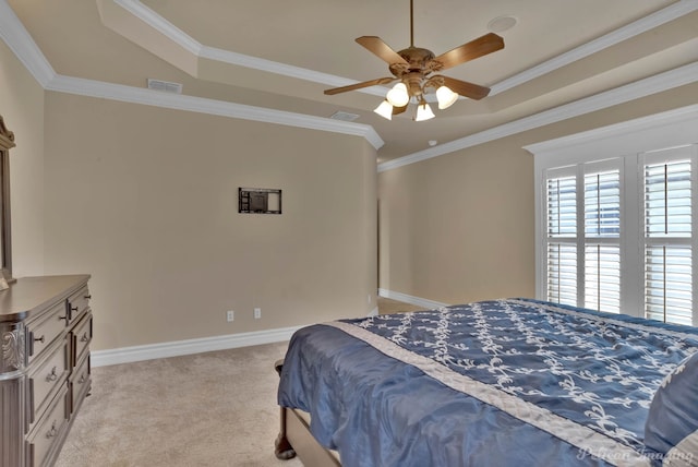 bedroom with light carpet, ornamental molding, a raised ceiling, and ceiling fan