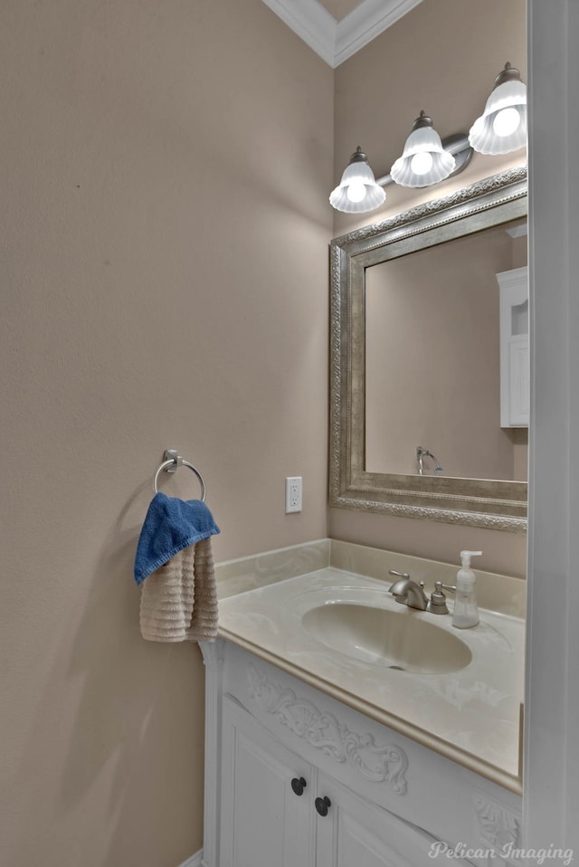 bathroom featuring vanity and ornamental molding