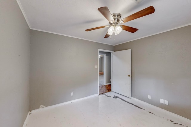 empty room with ornamental molding and ceiling fan