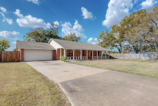 ranch-style house featuring a front lawn and a garage