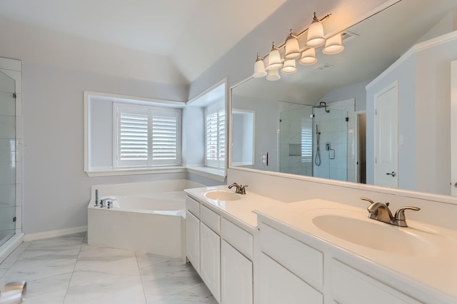 bathroom with vanity, lofted ceiling, and shower with separate bathtub