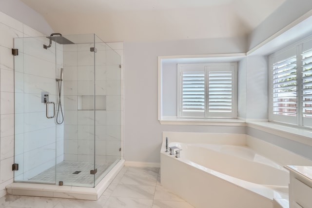 bathroom featuring vanity and shower with separate bathtub