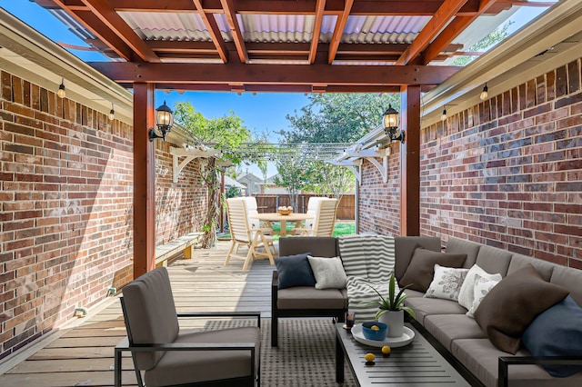 wooden terrace with an outdoor hangout area