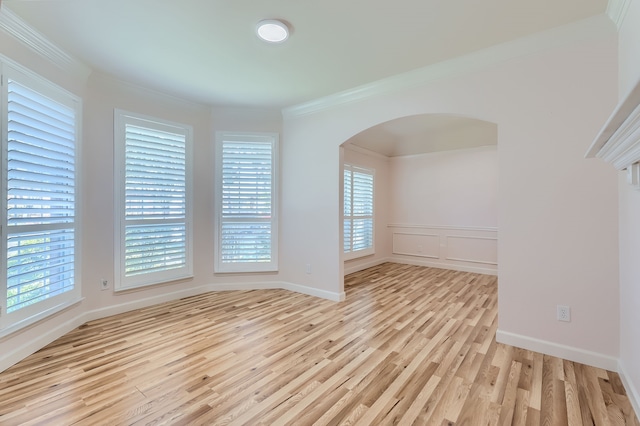 spare room with light hardwood / wood-style floors and ornamental molding