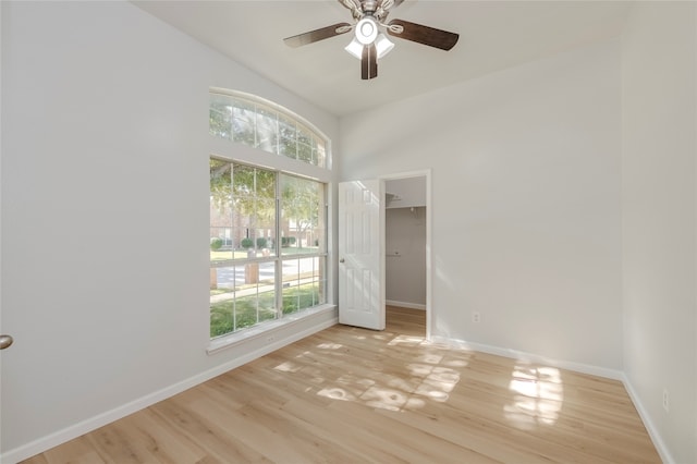 unfurnished room featuring light hardwood / wood-style floors and ceiling fan