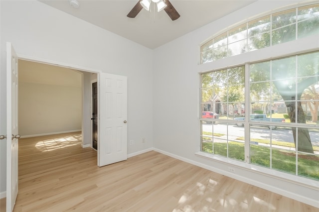 unfurnished room featuring light hardwood / wood-style floors and ceiling fan