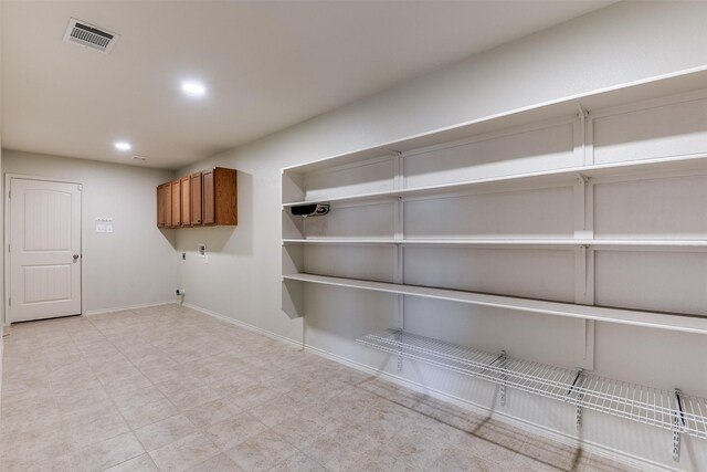 unfurnished dining area featuring light tile patterned floors and a notable chandelier