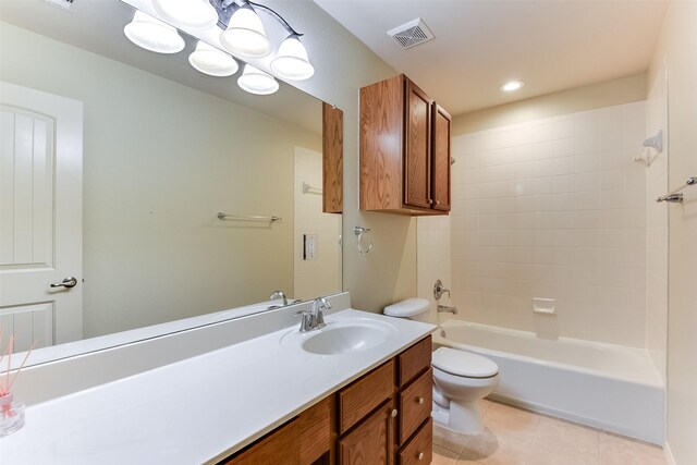 full bathroom with visible vents, shower / washtub combination, toilet, tile patterned floors, and vanity