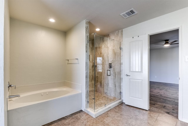 bathroom with tile patterned floors, visible vents, a garden tub, and a stall shower