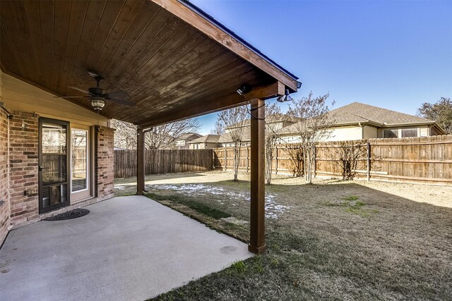 rear view of house with a lawn and a patio area