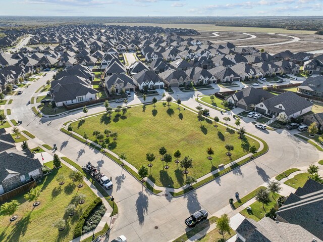 birds eye view of property with a residential view