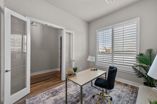 office featuring wood finished floors and baseboards