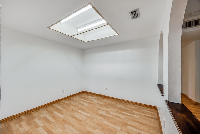 empty room featuring hardwood / wood-style floors