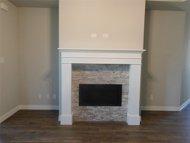 room details with a stone fireplace and hardwood / wood-style flooring