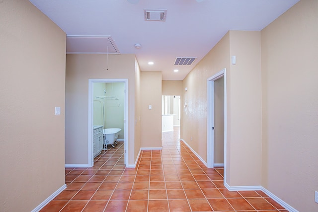 hallway with light tile patterned floors