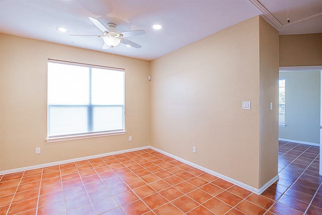 tiled empty room with ceiling fan