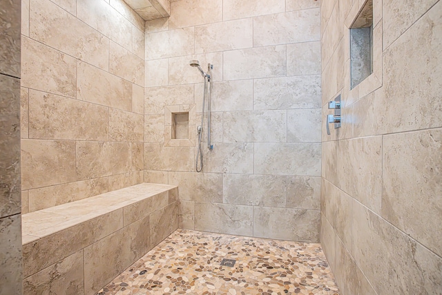 bathroom featuring tiled shower