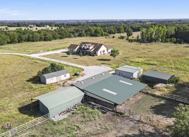 birds eye view of property with a rural view