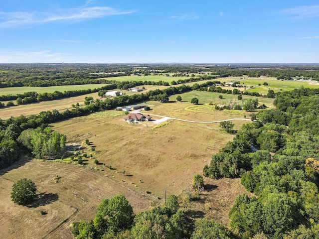 birds eye view of property with a rural view