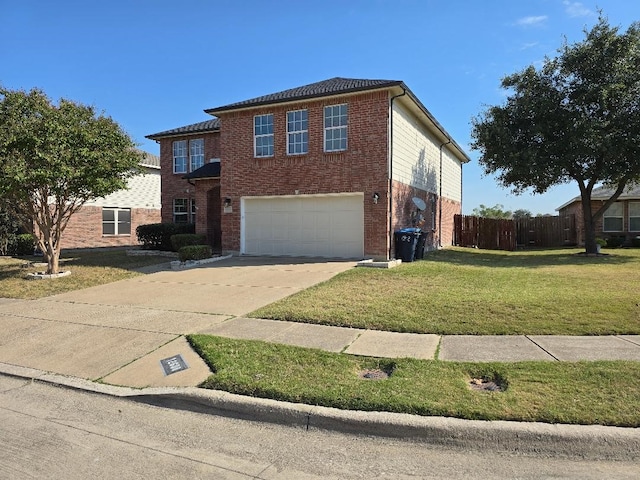 view of front of home with a front yard and a garage