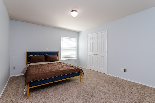 carpeted bedroom with a closet