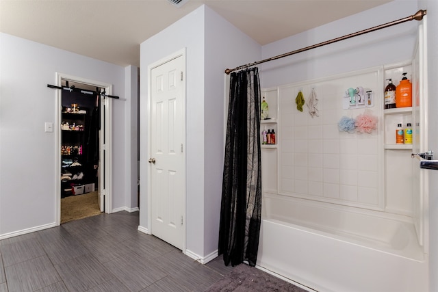 bathroom with shower / bath combination with curtain