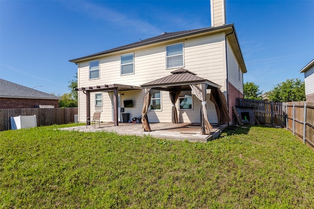 back of house featuring a gazebo, a yard, and a patio