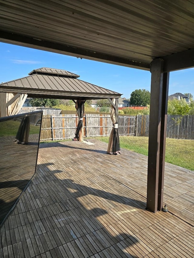 wooden terrace featuring a gazebo