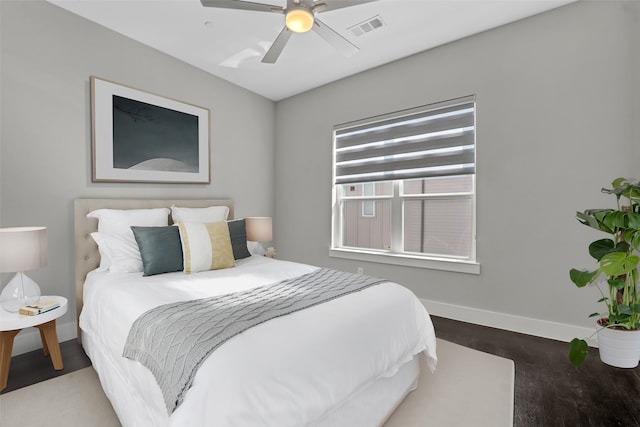 bedroom featuring dark hardwood / wood-style floors and ceiling fan