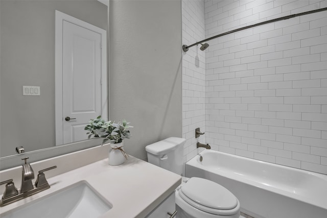 full bathroom with toilet, tiled shower / bath, and vanity