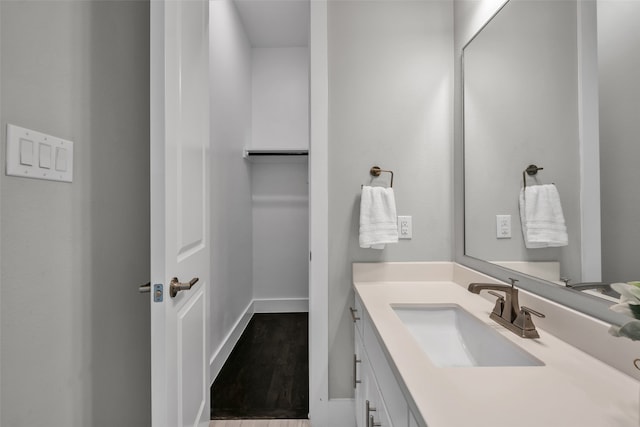 bathroom with vanity and hardwood / wood-style flooring