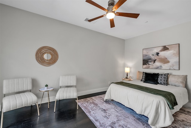 bedroom with wood-type flooring and ceiling fan