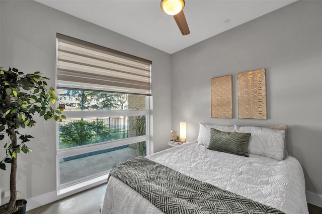 bedroom with concrete floors and ceiling fan