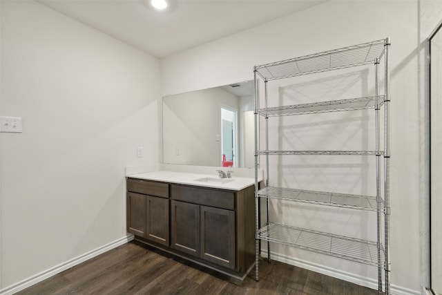 bathroom with vanity and wood-type flooring