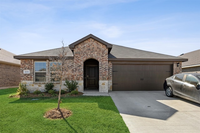 single story home featuring a front lawn and a garage