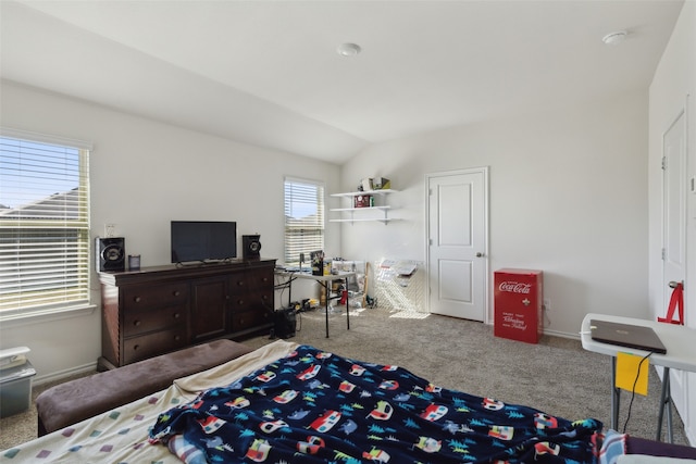 carpeted bedroom featuring lofted ceiling