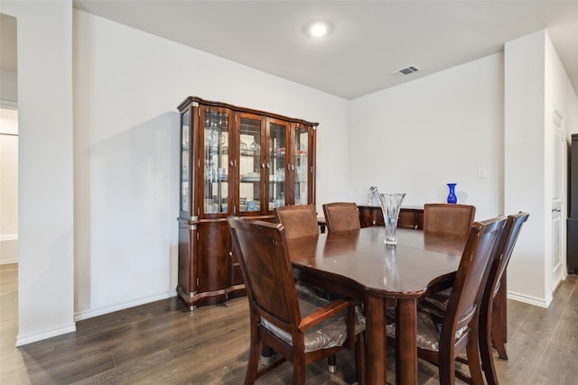 dining room featuring dark wood-type flooring