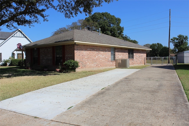 view of property exterior with a lawn