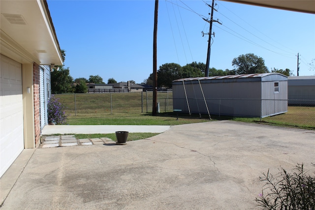 view of patio with a storage shed