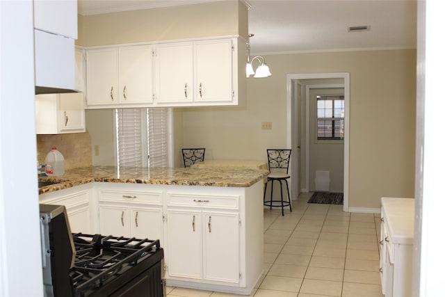 kitchen featuring ornamental molding, pendant lighting, light stone countertops, white cabinets, and kitchen peninsula