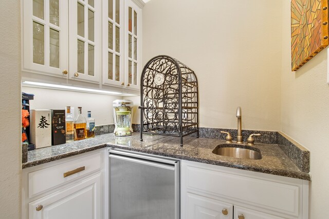 tiled dining area featuring decorative columns, crown molding, a healthy amount of sunlight, and a notable chandelier