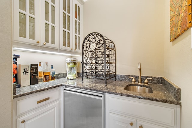 bar with wet bar and a sink