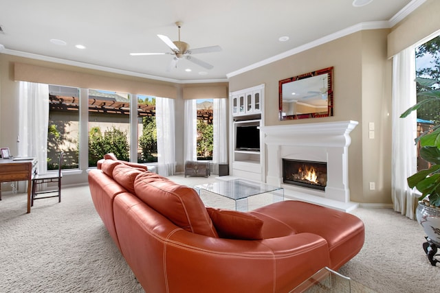 living room featuring ceiling fan, light colored carpet, and ornamental molding