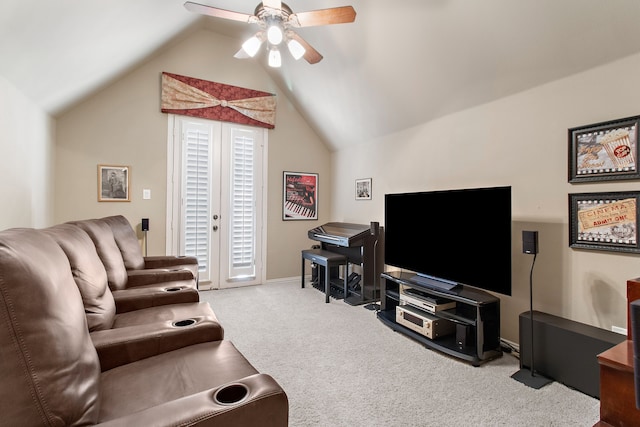 carpeted living room with ceiling fan and vaulted ceiling