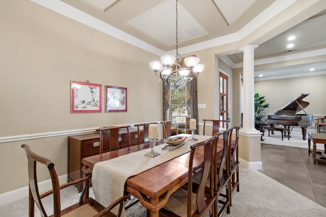 tiled dining room featuring baseboards, decorative columns, and crown molding