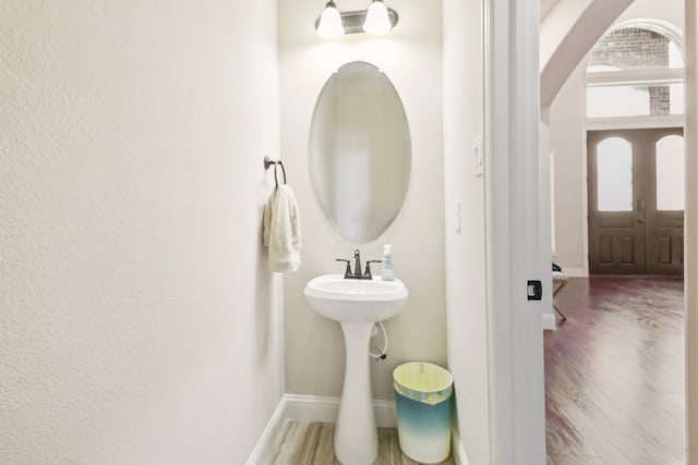 bathroom with wood-type flooring